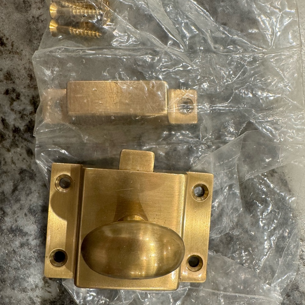 Brushed brass cabinet latch